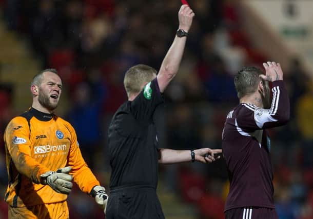 Referee Brian Colvin showsSt Johnstone keeper Alan Mannus the red card. Picture: SNS