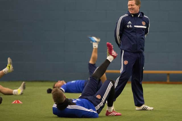 The mood is positive as Hearts manager Gary Locke supervises training yesterday. Picture: SNS