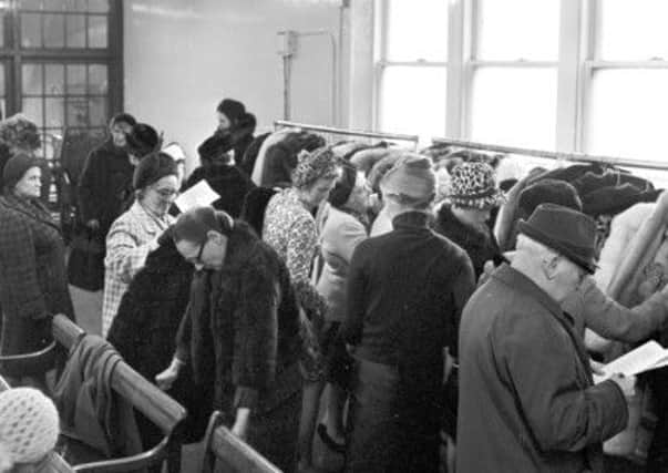 Edinburgh residents shop for fur coats in a city auction house. Picture: TSPL