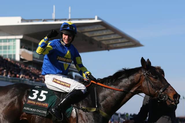 Ryan Mania and the nowretired Auroras Encore after their 2013 Aintree glory run. Picture: AFP/Getty