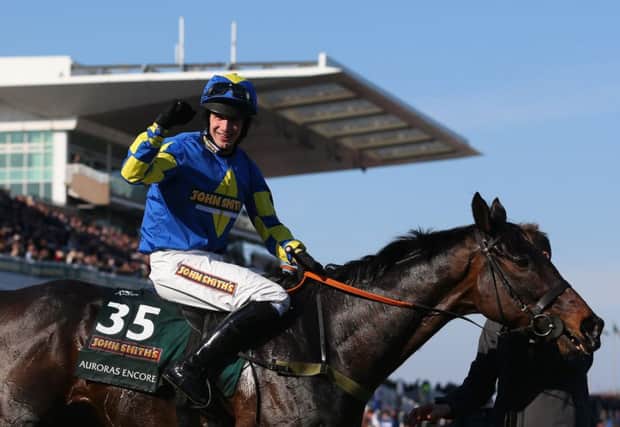 Ryan Mania and the nowretired Auroras Encore after their 2013 Aintree glory run. Picture: AFP/Getty