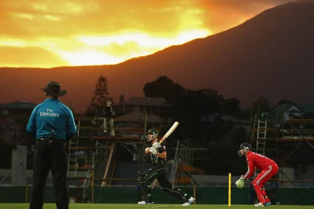Australias Cameron White targets the short boundary as the sun goes down in Hobart. Picture: Getty