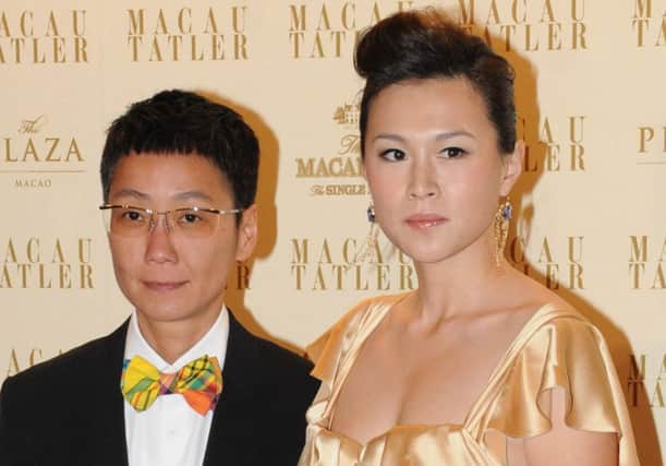 Gigi Chao, right, with her partner, Sean Eav. Picture: Apple Daily/AFP/Getty Images