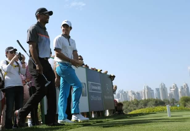 Current world No 1 Tiger Woods, left, and Rory McIlroy walk to the eighth tee. Picture: Reuters