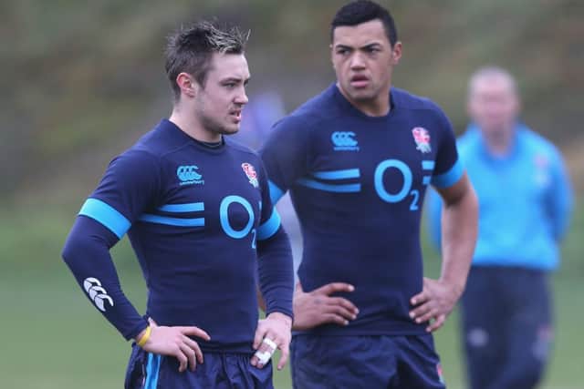 Backs Jack Nowell, left, and Luther Burrell look on during an England training session. Picture: Getty