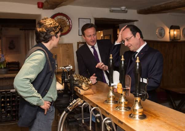 David Cameron and Francois Hollande at The Swan Inn at Swinbrook in Oxfordshire. Picture: PA