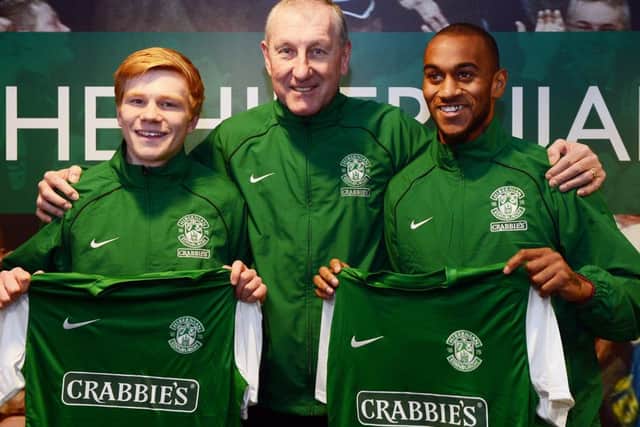Hibs manager Terry Butcher is joined by new loan signings Duncan Watmore, left, and Danny Haynes. Picture: Neil Hanna