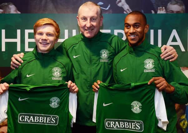 Hibs manager Terry Butcher is joined by new loan signings Duncan Watmore, left, and Danny Haynes. Picture: Neil Hanna