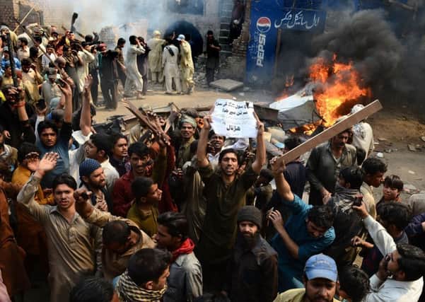 Angry Lahore residents stage a demonstration decrying blasphemy. Picture: Getty