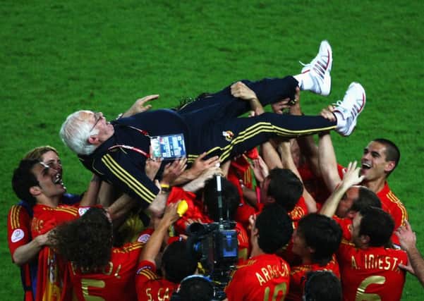 Aragones is lifted by players following Spain's victory over Germany in the UEFA Euro 2008 Final. Picture: Getty