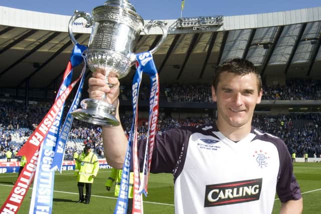Lee McCulloch lifts the Scottish Cup after beating Queen of the South in 2008. Picture: SNS