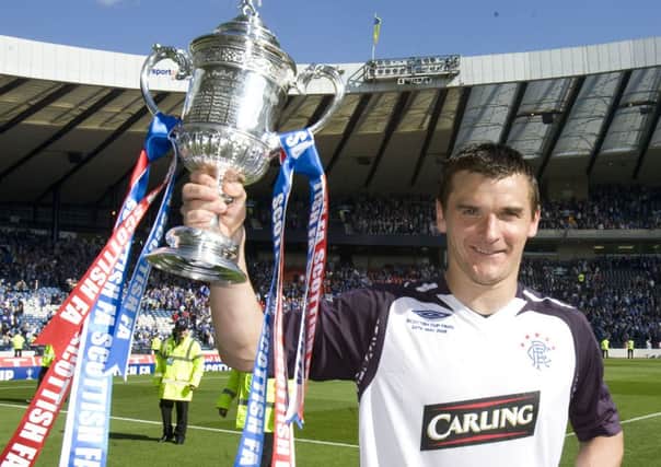 Lee McCulloch lifts the Scottish Cup after beating Queen of the South in 2008. Picture: SNS
