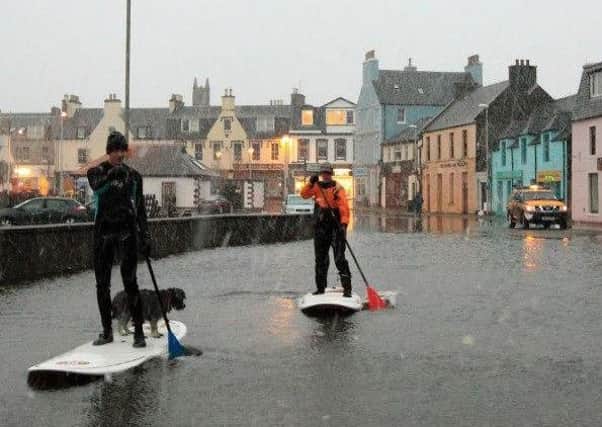 Two Stornoway residents use their bodyboards to get around. Picture: Malcolm Macleod