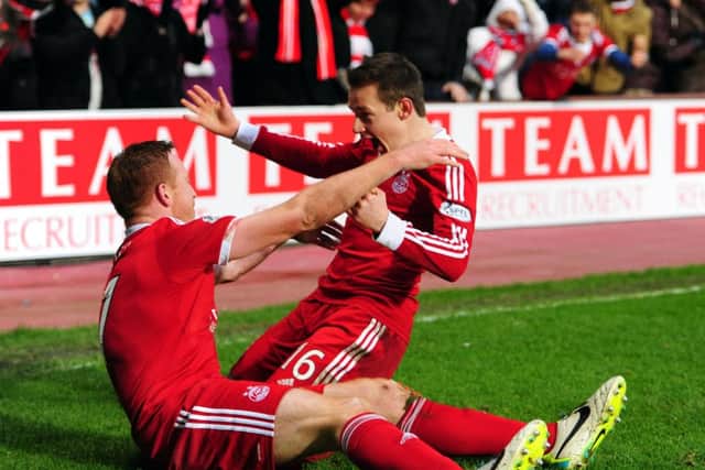 Adam Rooney celebrates with Peter Pawlett  after scoring the third Aberdeen goal. Picture:Ian Rutherford