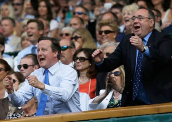 David Cameron, left and Alex Salmond cheer on Andy Murray. Salmond has renewed calls for a debate. Picture: Getty