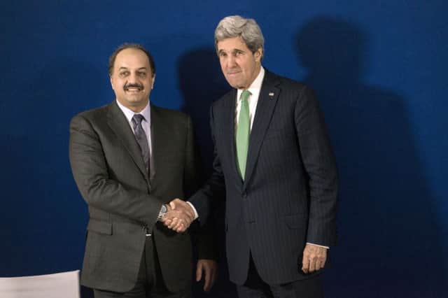 John Kerry, right, and his Qatari counterpart at the conference. Picture: Getty