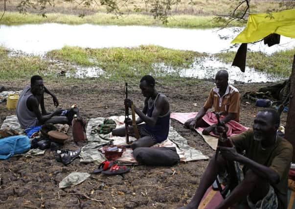 Rebel fighters keep their weapons in good order in a camp in Jonglei State. Picture: Reuters