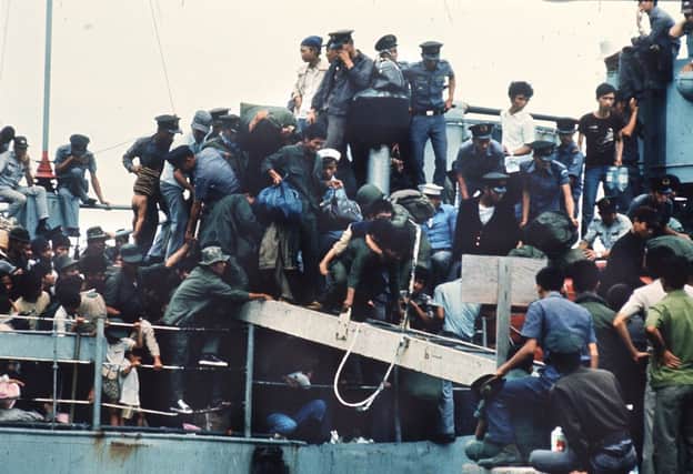 A boat arrives at Vung Tau port in Vietnam with more than 7,000 refugees on board as formal ceasefire is signed in 1973. Picture: Getty