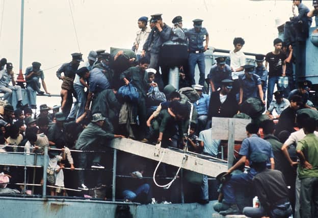 A boat arrives at Vung Tau port in Vietnam with more than 7,000 refugees on board as formal ceasefire is signed in 1973. Picture: Getty