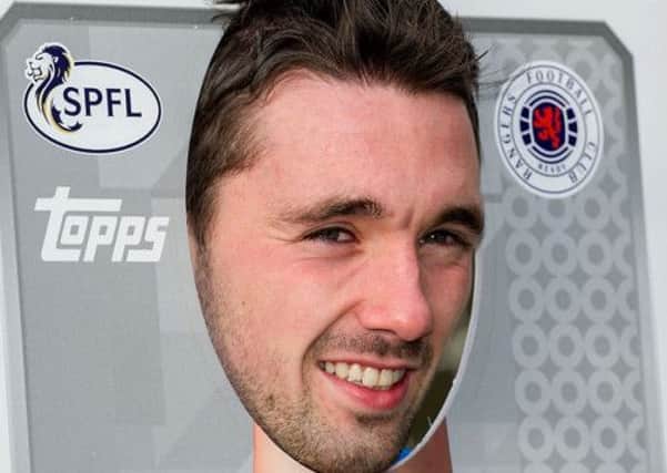 Rangers striker Nicky Clark puts his neck on the line to promote the new SPFL sticker album. Picture: SNS