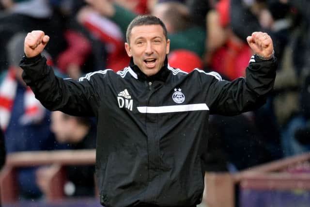 Derek McInnes celebrates after Aberdeen 's 4-0 win. Picture: SNS