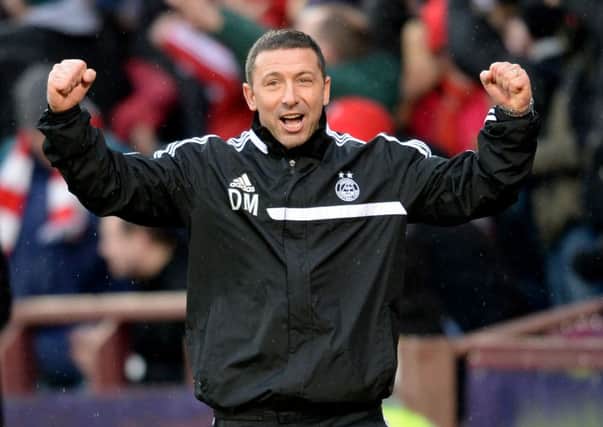 Derek McInnes celebrates after Aberdeen 's 4-0 win. Picture: SNS