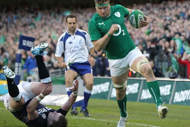 Jamie Heaslip evades a tackle from Scotland's full back Stuart Hogg. Picture: Getty
