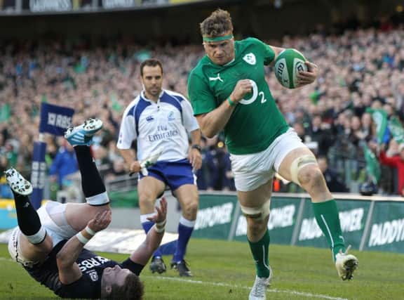 Jamie Heaslip evades a tackle from Scotland's full back Stuart Hogg. Picture: Getty
