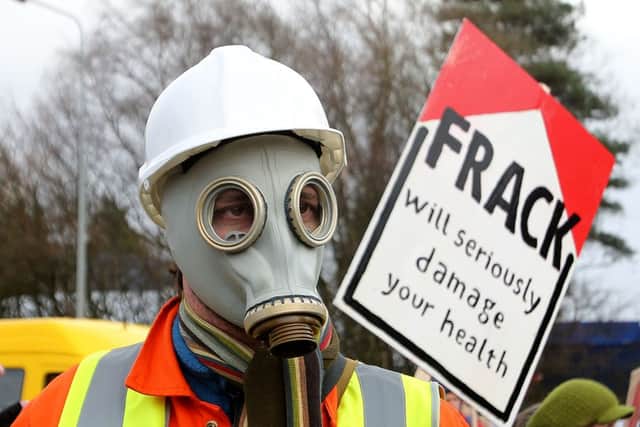 An anti-fracking protestor. MSPs voiced concern about 'radioactive' materials being flushed during methane extraction. Picture: PA