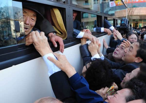 North Korean guests bid their South Korean relatives farewell after a family reunion. Picture: Getty
