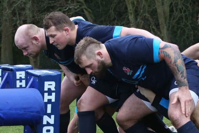 England frontrow Dan Cole, left, Dylan Hartley and Joe Marler, right, practice scrummaging ahead of the Calcutta Cup match. Picture: Getty