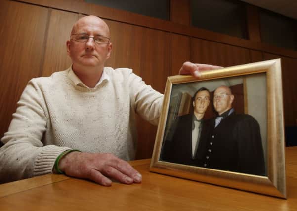 John Geary, pictured with a photograph of his son Dean, has appealed for more information on the events of 7 February 2010. Picture: PA