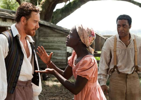 Michael Fassbender, left, Lupita Nyong'o and Chiwetel Ejiofor in 12 Years A Slave. Fassbender is Skye-bound for Macbeth Picture: PA