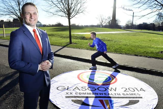 Athlete Derek Hawkings. right, helps David Grevemberg, chief executive of Glasgow 2014, launch the marathon route. Picture: Sandy Young
