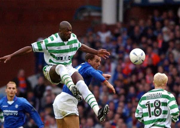 A industrial challenge from Bobo Balde on Ronald de Boer during a 2002 Old Firm clash. Picture: Robert Perry
