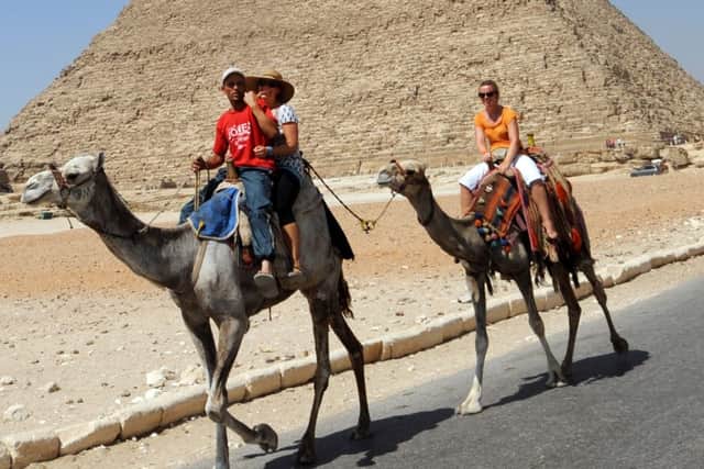 Trekking tourists at Giza in Egypt. Picture: Getty