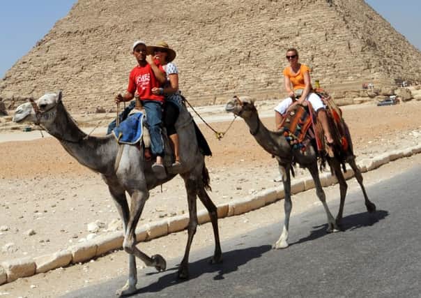 Trekking tourists at Giza in Egypt. Picture: Getty