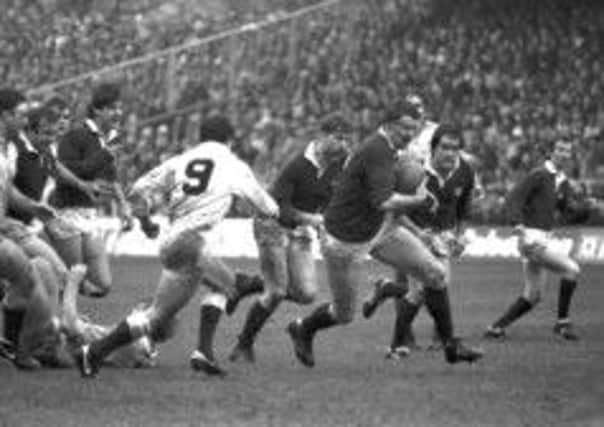 Alan Tomes attacks the English defence during the 18 - 6 win. Picture: TSPL