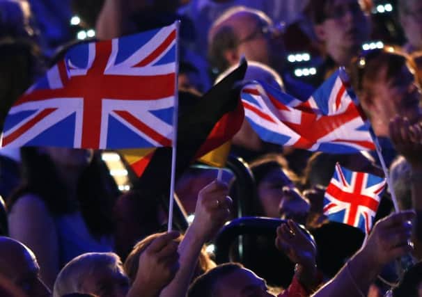 Union Jack flags waved during the closing ceremony of the 2012 London Olympic Games. Picture: Getty