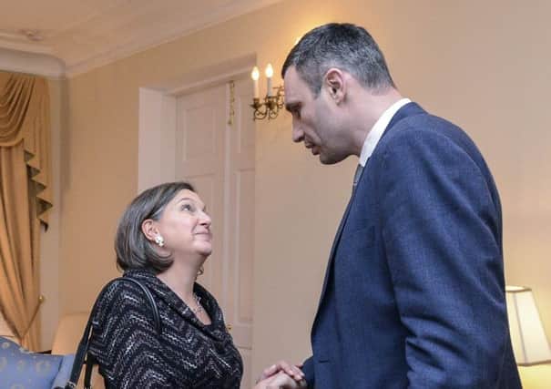 Ukrainian opposition leader Vitaly Klitschko shakes hands with U.S. Assistant Secretary of State Victoria Nuland. Picture: Reuters