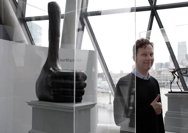 Shrigley with a maquette of his sculpture 'Really Good'. Picture: Getty
