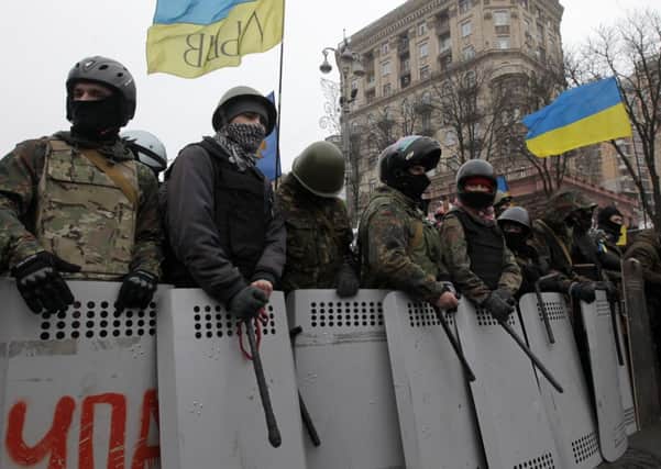 Pro-European Union activists stand in front of a barricade in downtown Kiev. Picture: AP