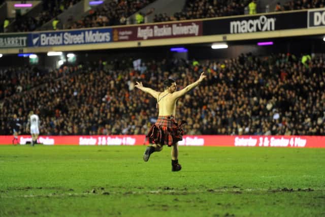 A kilted streaker, who showed more verve than most of the Scottish backs. Picture: Jane Barlow