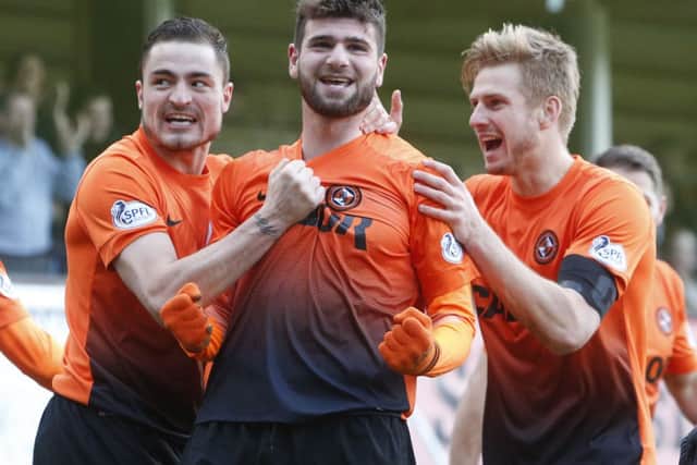 Dundee United's Nadir Ciftci celebrates his goal with team-mates Paul Paton (left) and Stuart Armstrong (right). Picture: PA