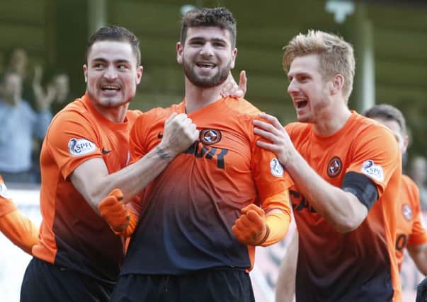 Dundee United's Nadir Ciftci celebrates his goal with team-mates Paul Paton (left) and Stuart Armstrong (right). Picture: PA