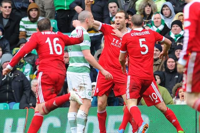 Russell Anderson celebrates his equaliser at Parkhead on Saturday. Picture: Robert Perry