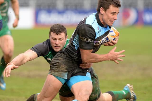 Glasgow Warriors' debutant Lee Jones (right) is tackled by John Muldoon of Connacht. Picture: SNS