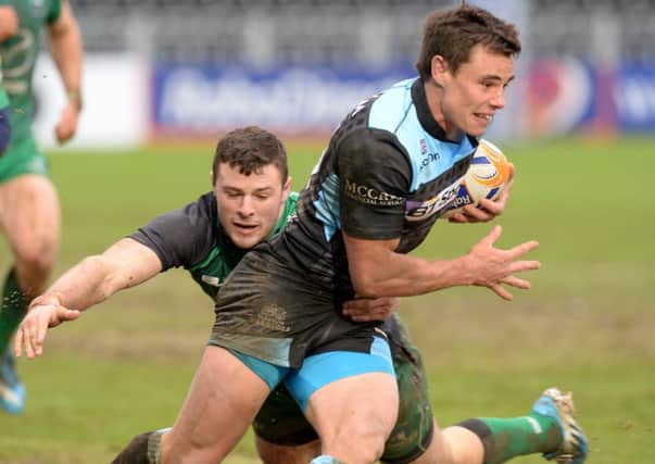 Glasgow Warriors' debutant Lee Jones (right) is tackled by John Muldoon of Connacht. Picture: SNS