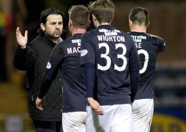 New Dundee manager Paul Hartley congratulates his players following their 10 victory. Picture: SNS Group