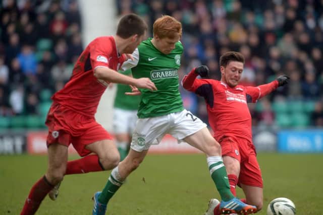 Duncan Watmore is challenged by Raith winger Joe Cardle, right. Picture: Phil Wilkinson